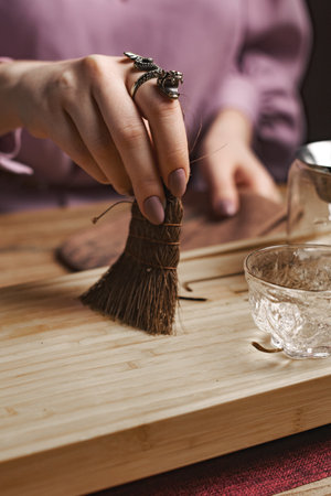 Enjoy an elegant tea ceremony with artisan brushes and exquisite glassware, merging beautyの写真素材