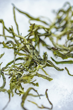 A CloseUp of Dried Seaweed Set Against a Clean White Background for Culinary Useの写真素材