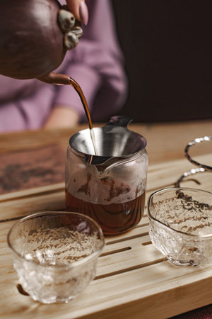 The Art of Artisan Tea Brewing with Beautifully Crafted Elegant Glassware and Pouring Kettle