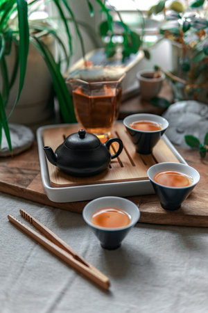 An Elegant Tea Ceremony featuring a beautifully designed Teapot and elegant Cups for serving
