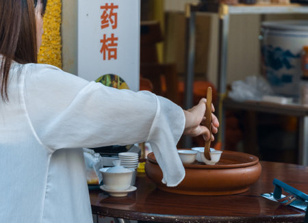 Exploring the Traditional Preparation of Herbal Medicine Within a Vibrant Market Environmentの写真素材