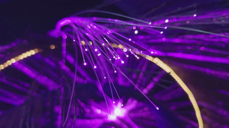 Fiber optic lamp shining with purple light. Actionの写真素材