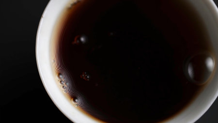Pouring Hot Beverage into a Ceramic Cup. Mediaの写真素材