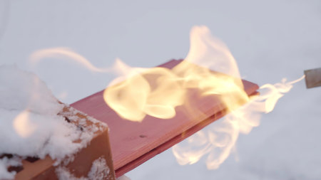 An experienced specialist demonstrates the technique of wood processing using fire. Creativeの写真素材