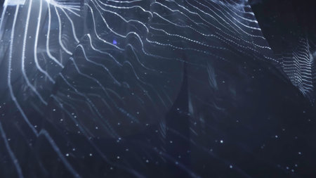 Abstract wavy surface gently moving with particles on dark background. Action