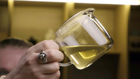 Pouring a Liquid in a Laboratory Setting Requires Precise Measurement and Safety Precautions. Mediaの写真素材