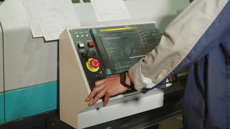 The Industrial Machinery Control Panel is currently in use for monitoring operations and settings....