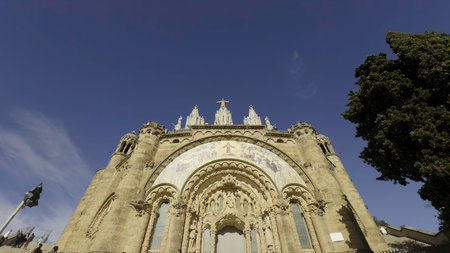 Tourists visiting tibidabo church in barcelona on sunny day.の写真素材