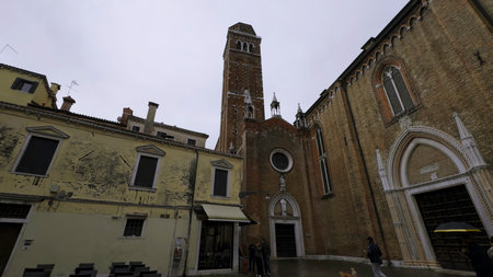 Tourists walking in venice near campo san barnaba church. Actionの写真素材
