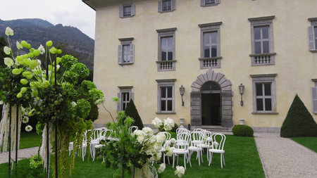 Elegant outdoor wedding venue setup at historic villa. Actionの写真素材