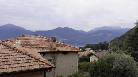 A rooftop with lake como and alps in background. Actionの写真素材