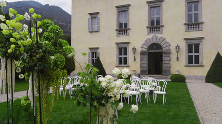 Elegant outdoor wedding venue setup at historic villa. Actionの写真素材