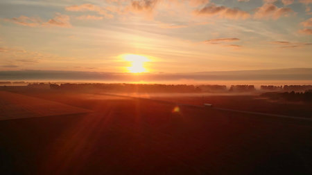 Truck driving on country road during sunrise.の写真素材