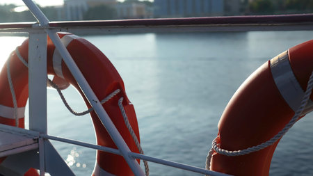 Lifebuoy on a moving ship during a sunny day cruise. Clipの写真素材