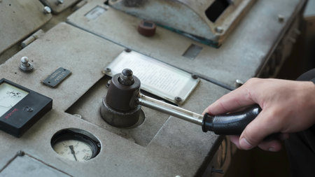 Operator turning vintage industrial machine control lever. Clipの写真素材