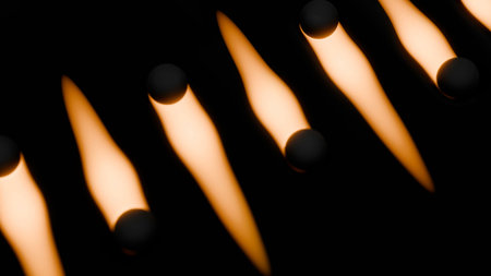 Dark spheres creating rhythmic glowing light patternsの写真素材