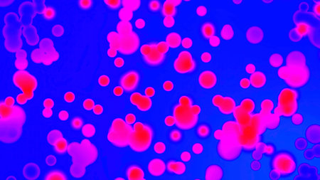 Microscopic bacteria cells multiplying in pink and blue liquid