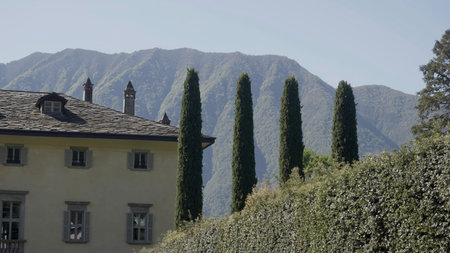 Elegant villa nestled in the italian alps during a sunny day. Actionの写真素材