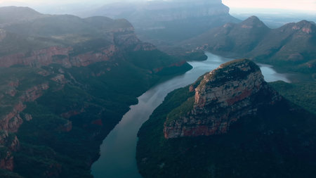unmanned aerial vehicle documents peaceful water paths and impressive rocky escarpments around...