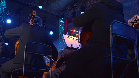 Silent Anticipation Fills Intimate Auditorium As Performers Prepare Under Cinematic Lighting Conditionsの写真素材