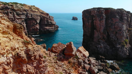 majestic red cliffs over serene waters, dramatic seaside landscape with rugged cliffs and tranquil...