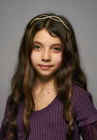 The beautiful, young girl with flowing hair and a diademの写真素材