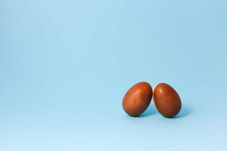 Chocolate easter eggs on blue background. Close up.jpgの写真素材