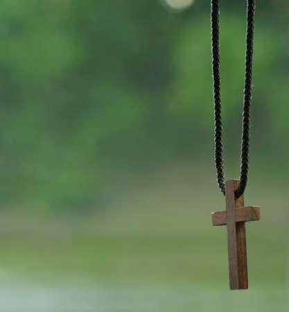 A small wooden cross. Shallow depth of field.の写真素材