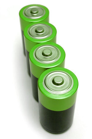 Four green batteries on white background.の写真素材