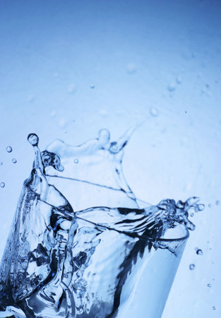 Ice splashing into a glass.