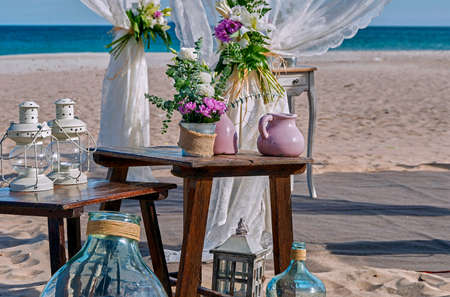 Beautiful decorations of the wedding set on the sand of the beach in the Mediterranean Sea.の写真素材