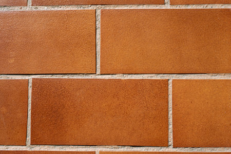 Terrace brick floor texture in large orange color pattern. Brick stone seen in detail from above.