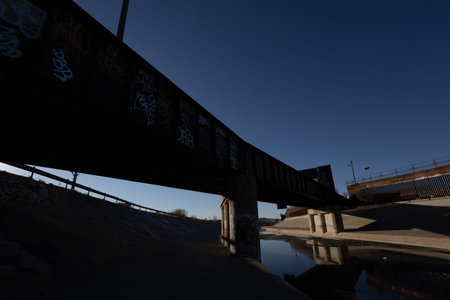 Railway bridge across the river at sunset, closeup of photo