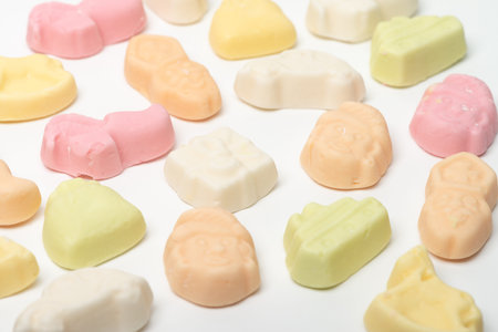 Background of sweets. Candy at Dutch Sinterklaas, pink, yellow, green, orange, grit, isolated...