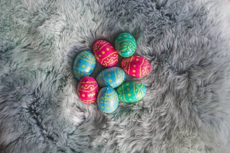 Colored chocolate Easter eggs on fur, pink, blue and green eggs, Amsterdam the Netherlandsの写真素材