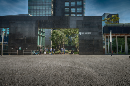 Amsterdam, Gustav Mahlerplein, The Netherlands, 08/23/2019, ABN AMRO bank, Zuidas in Amsterdam, Modern office buildings in Amsterdam, financial and business district, people on the streetsのeditorial素材