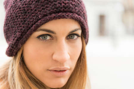 thoughtful young woman on the streetの写真素材