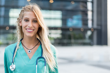Female doctor, nurse or vet outdoors smiling looking at the camera isolated portrait closeup.