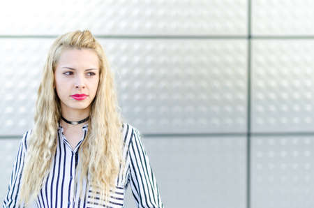 happy blonde young woman smiling isolatedの写真素材