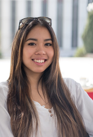 happy young woman portrait close up smiling with sunglasses