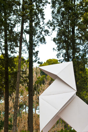 Origami monument among the treesの写真素材