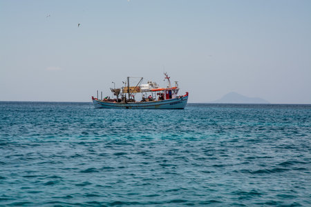 Fishing boat on a mediterranean islandの写真素材