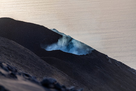 smoke from the erupting volcano on the island of Stromboliの写真素材