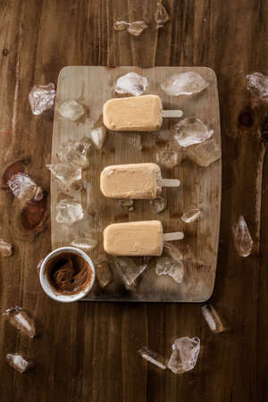 Homemade sweet milk ice cream garnished with pieces of ice and, top viewの写真素材