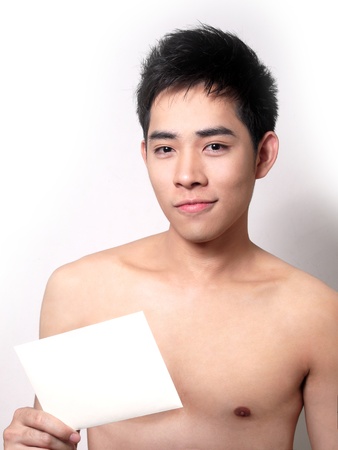 Asian boy hold a note for your textの写真素材
