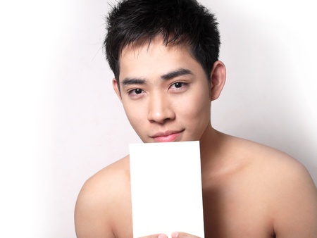 Asian boy hold a note for your textの写真素材