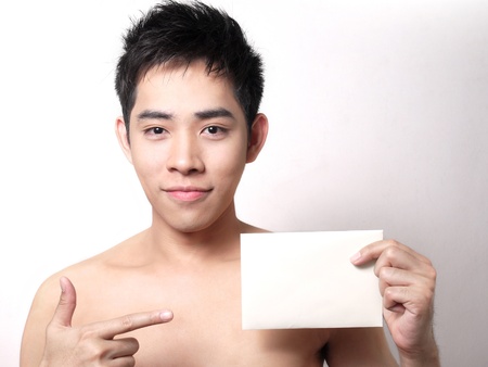 Asian boy hold a note for your textの写真素材