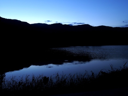 Mountain and lake at nightfallの写真素材