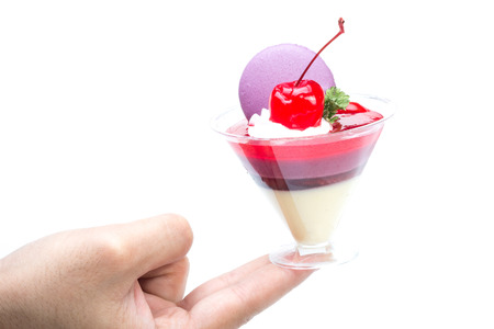 Strawberry shot cake with cherry and macaronの写真素材