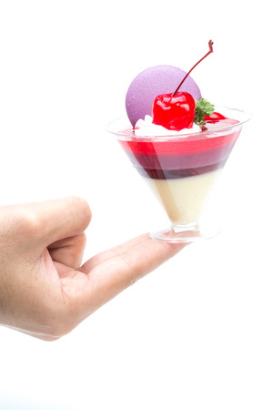 Strawberry shot cake with cherry and macaronの写真素材